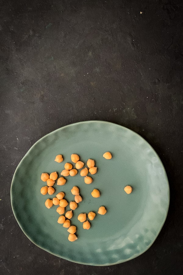 Chickpeas on green plate