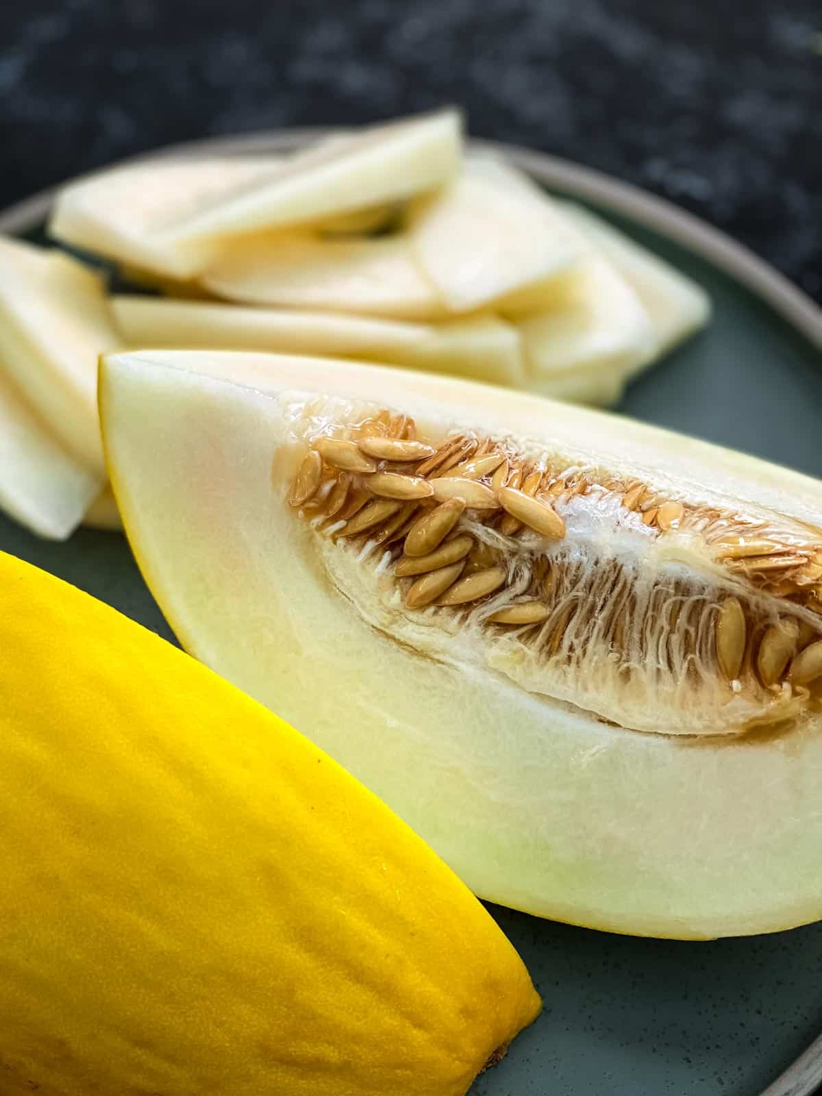 Wedge of canary melon with seeds