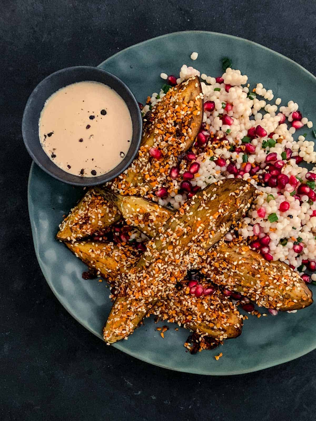 Dukkah Eggplant Baked Slices Salad with Pomegranate Molasses Yoghurt Dressing served on the side in a bowl