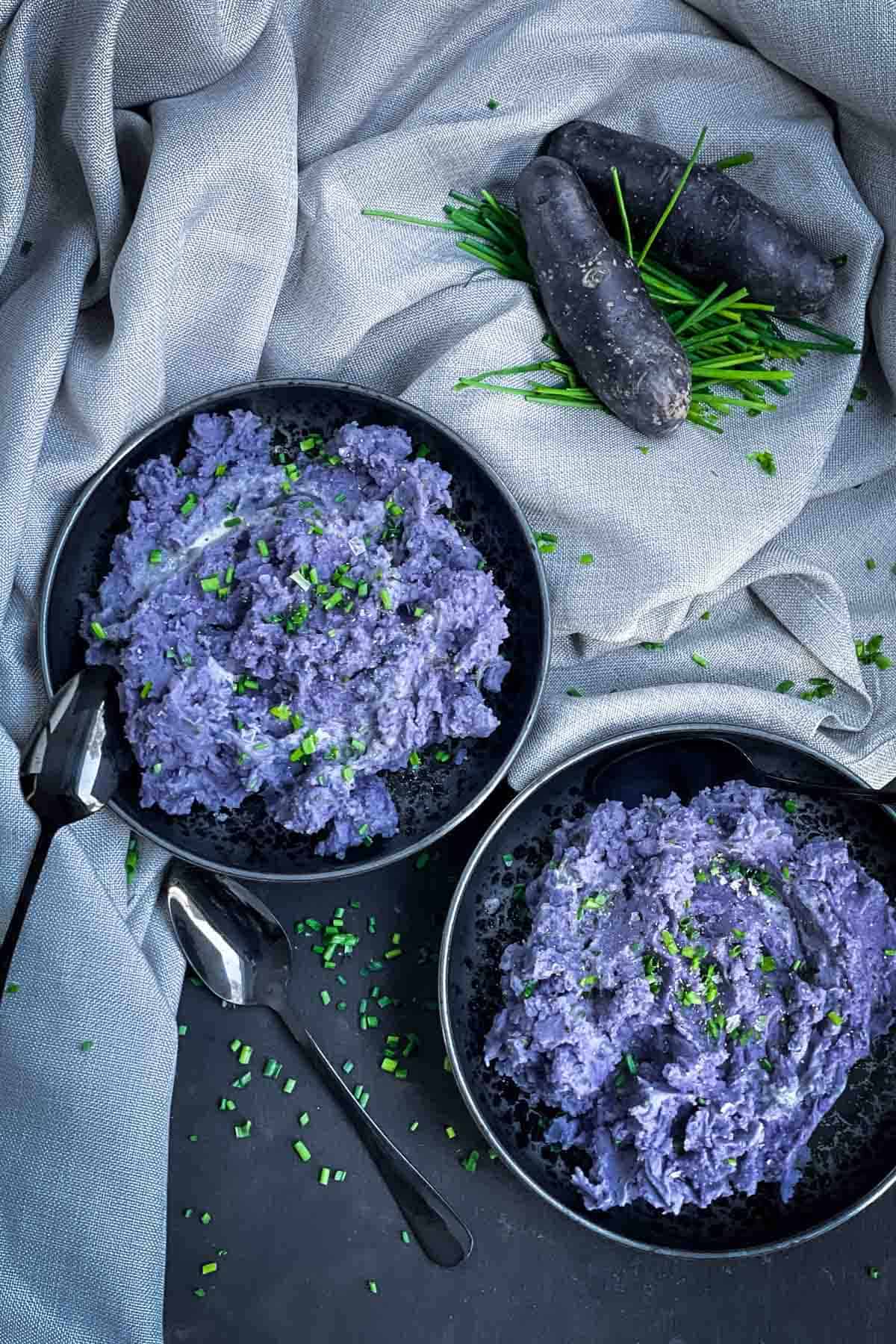 2 Purple Mashed Potatoes in a black bowls