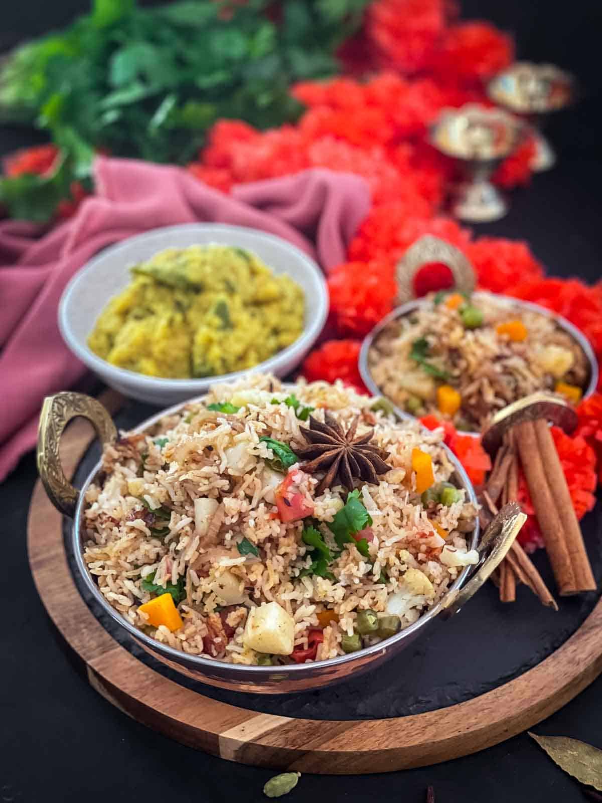 Diwali themed Veg Pulao (Easy Indian Rice Dish) on a slate and wooden board served with dahl