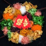 Homemade Yee Sang Recipe with red packets and wooden chopsticks