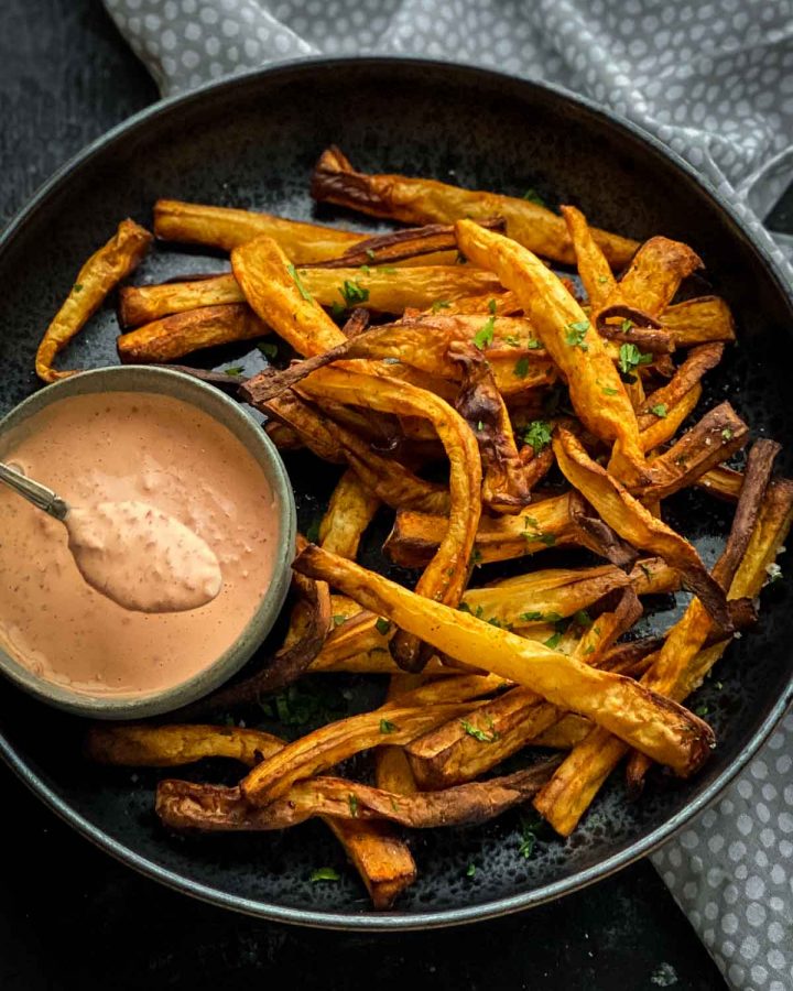 Air Fryer Parsnip Fries with Red Pepper Mayo on dotted grey and white napery