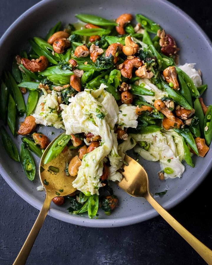 Sugar Snap Pea Salad with Fior di Latte in a grey bowl with gold spoon and fork