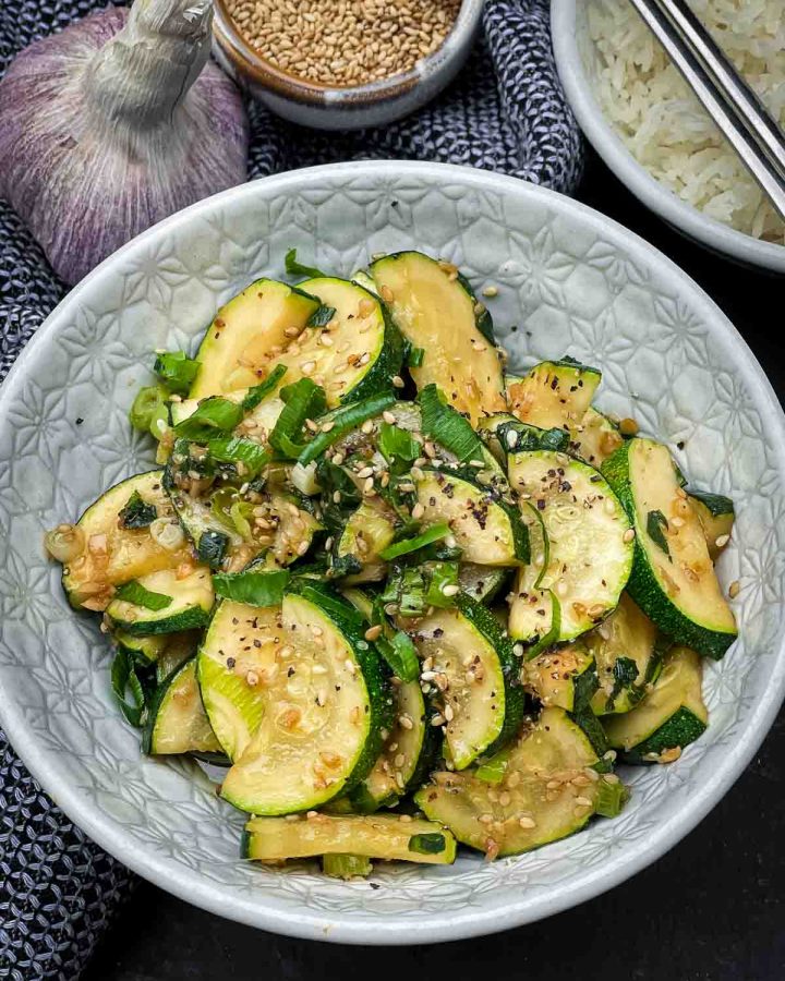 Korean Zucchini Side Dish - Hobak Bokkeum in a bowl served with rice