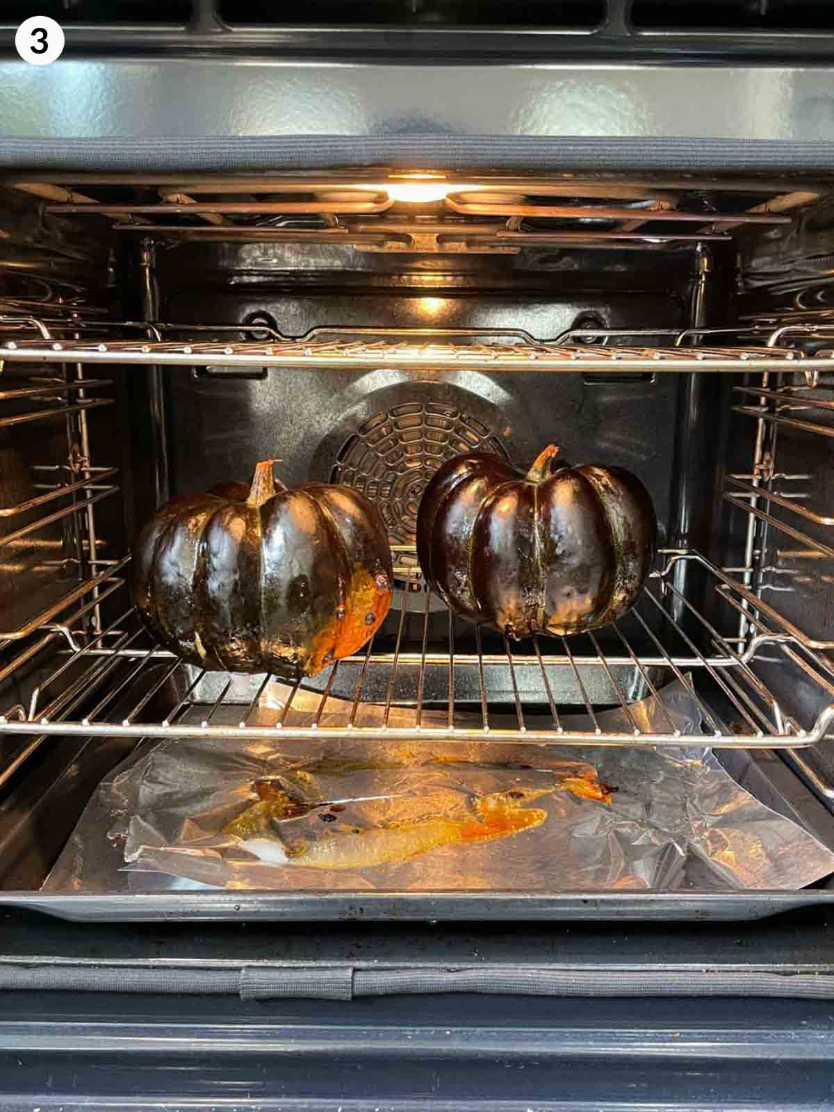 2 whole pumpkins roasting in the oven