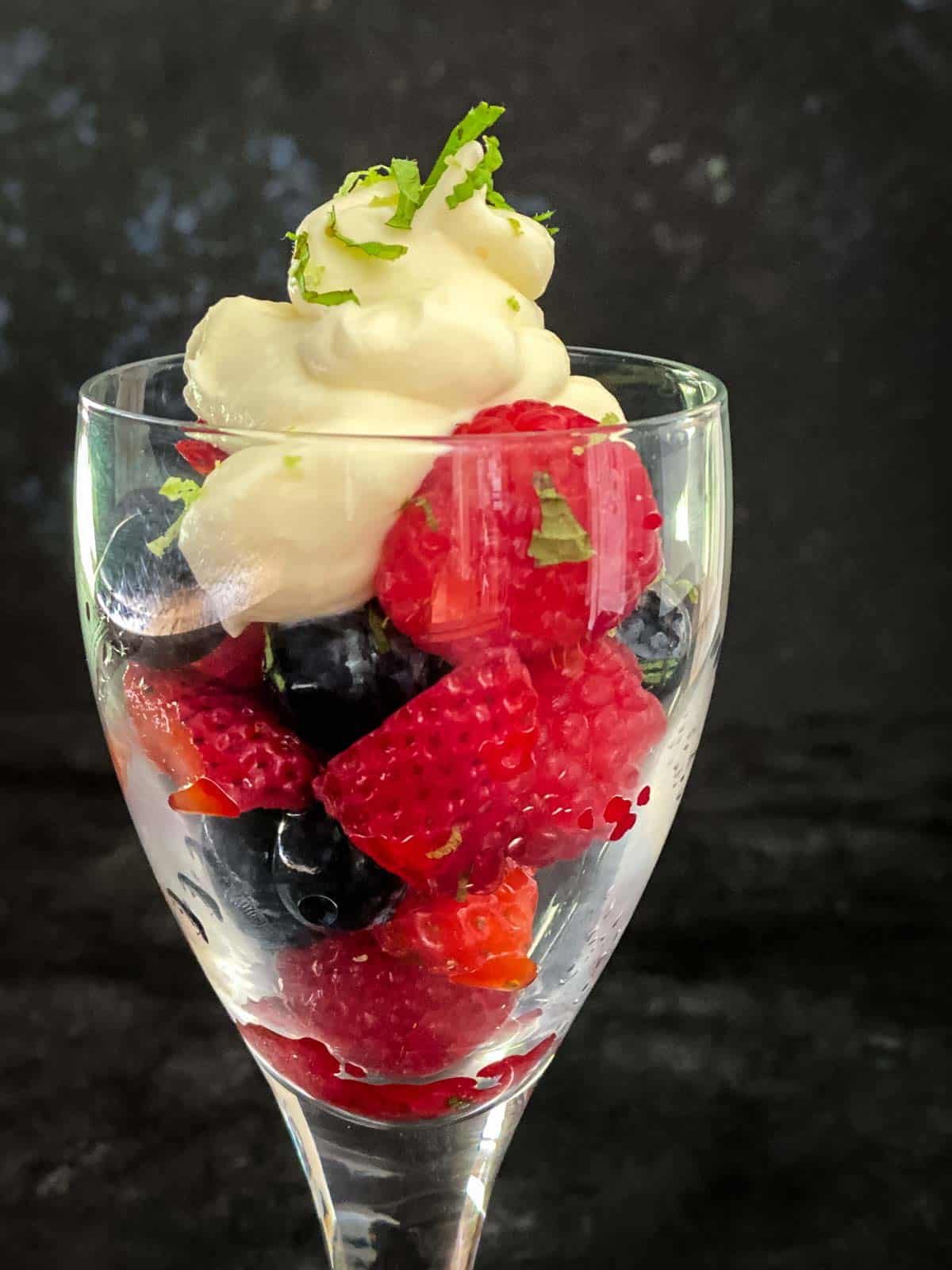 Easy Summer Mixed Berry Salad in a Champagne glass