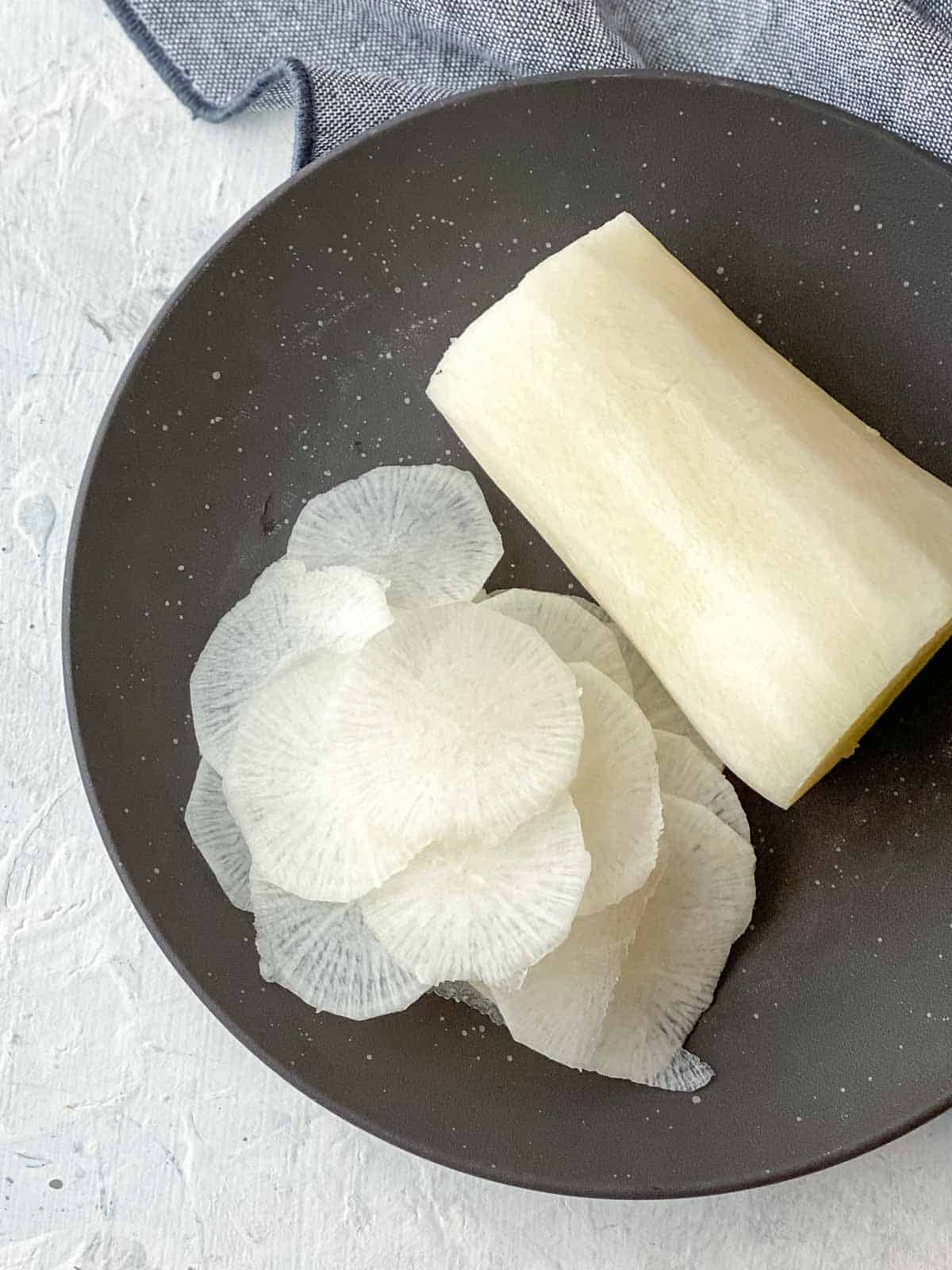 Shaved daikon on a brown plate