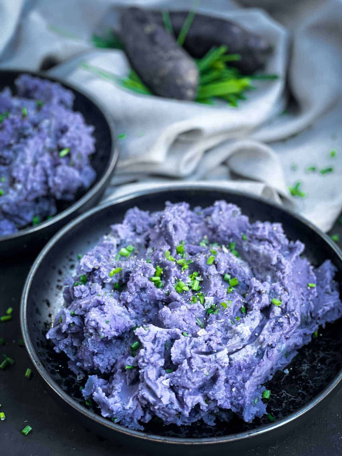 Purple Mashed Potatoes in a black bowl