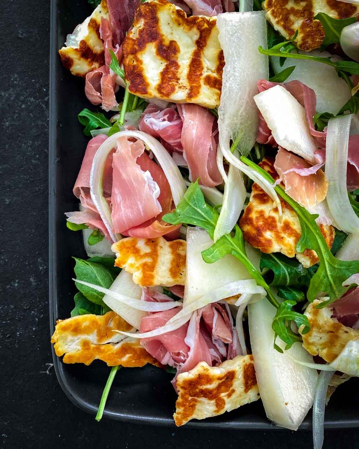 Canary Melon Salad with Halloumi in an oblong platter