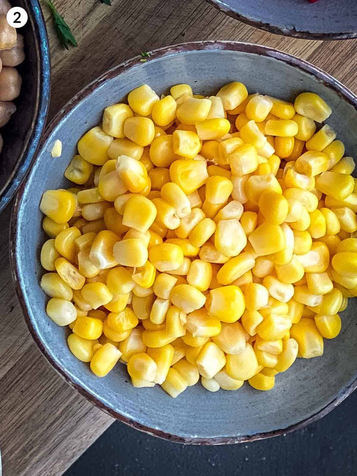 Corn kernels in a blue bowl