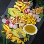 Yellow Nectarine Salad with Grilled Halloumi on a slate platter with black forks