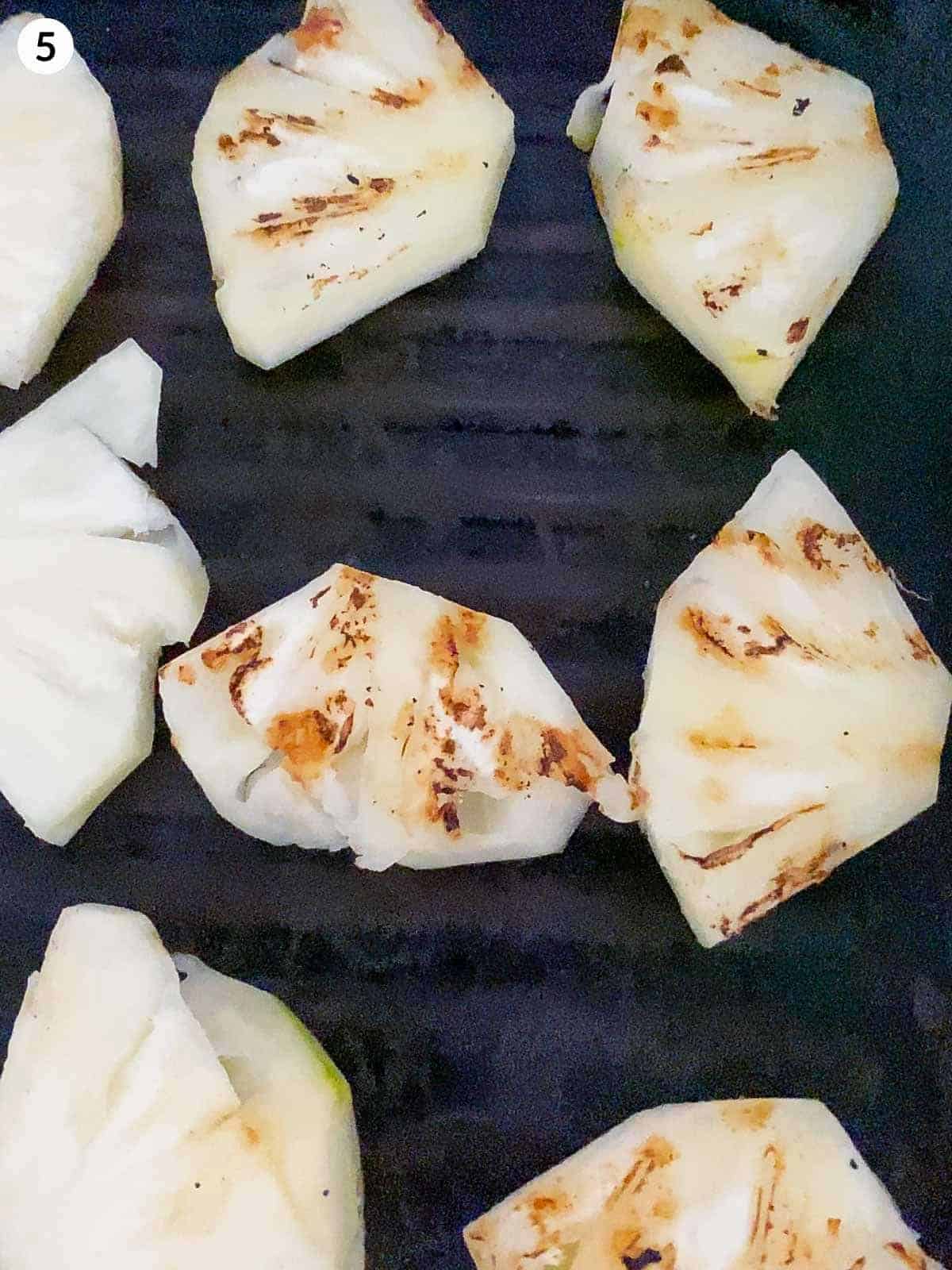 grilled pineapple slices on griddle pan