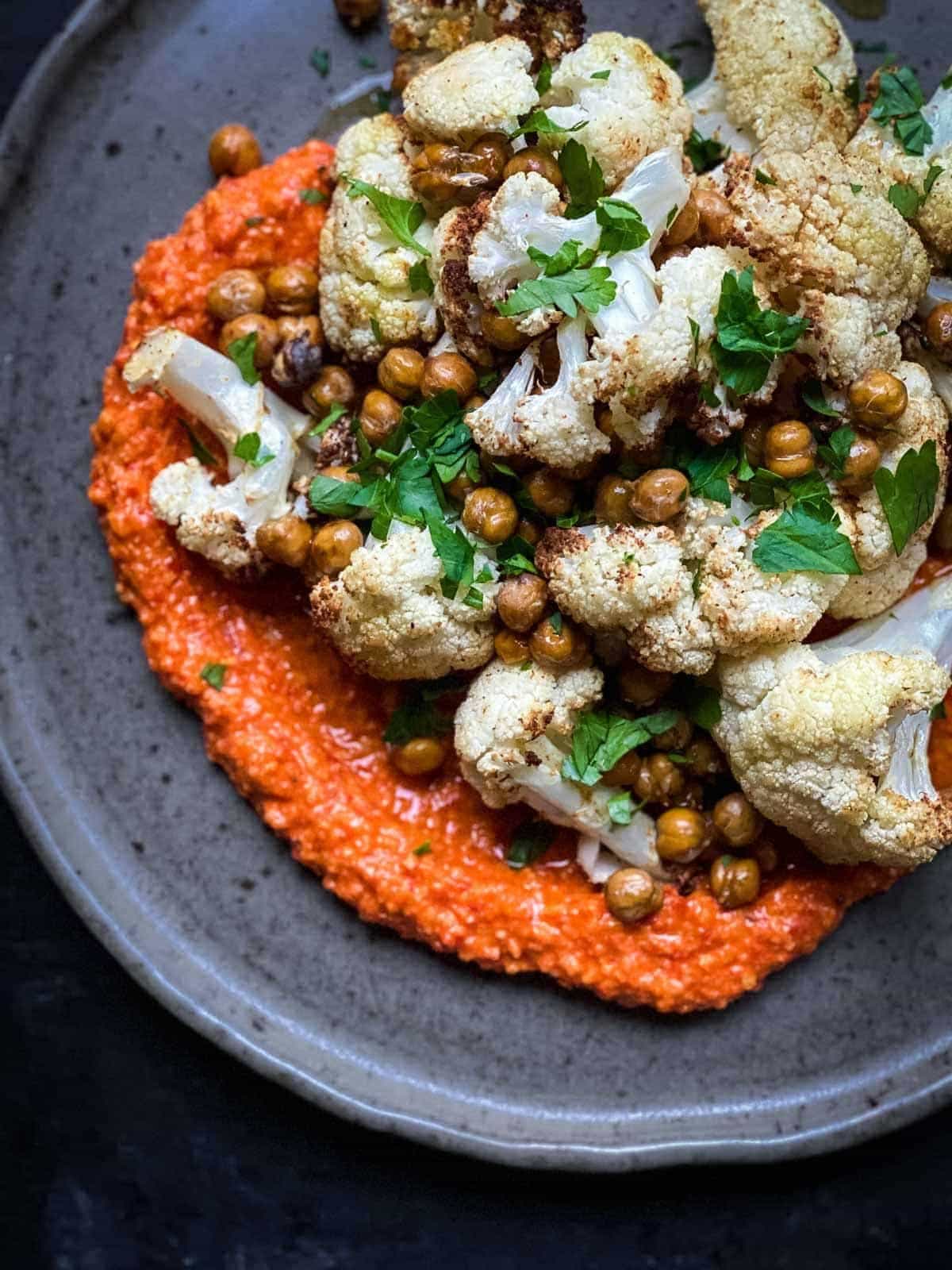 Air fryer roasted cauliflower and chickpeas on a grey plate