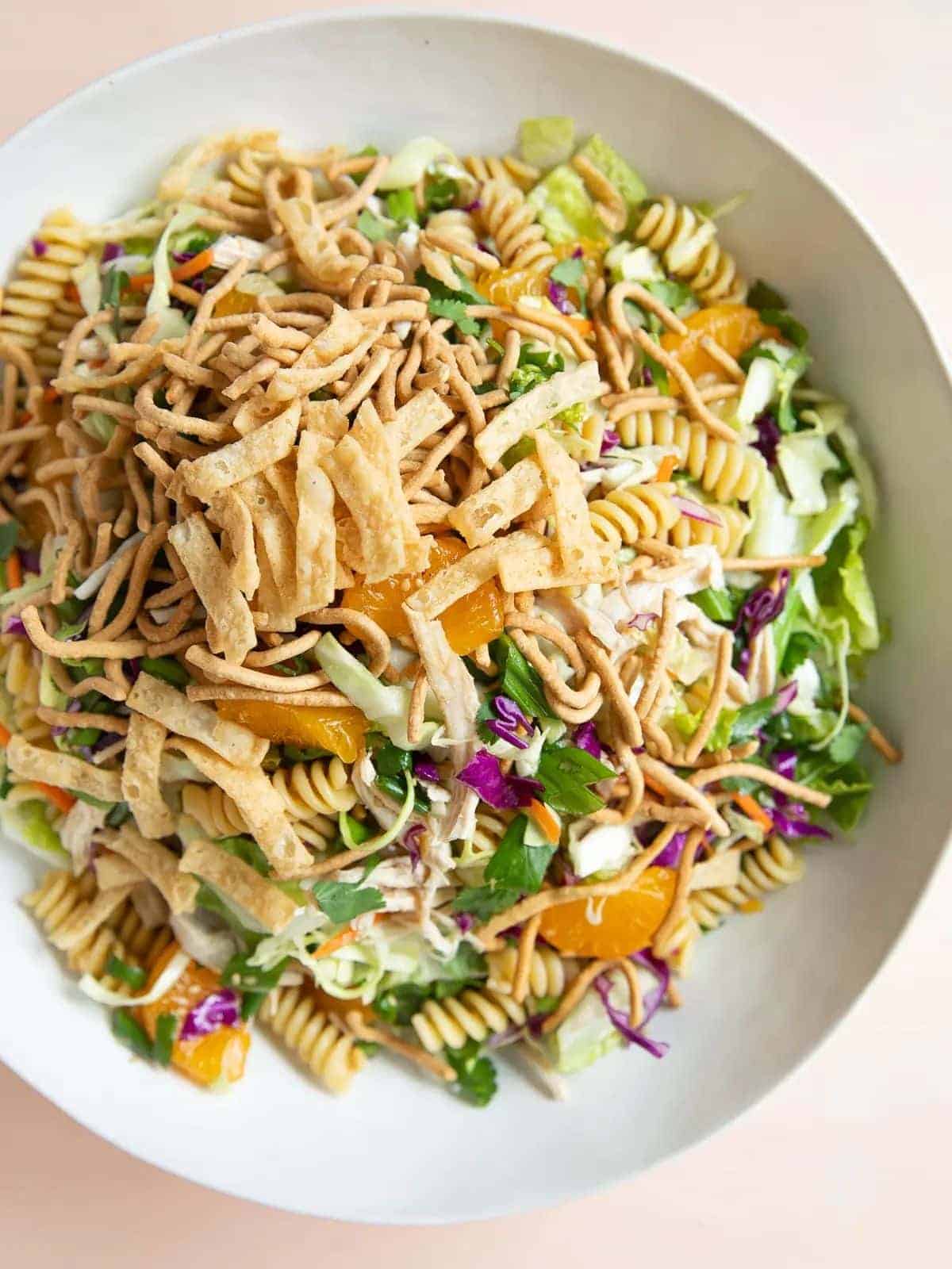Chinese chicken pasta salad in a white bowl