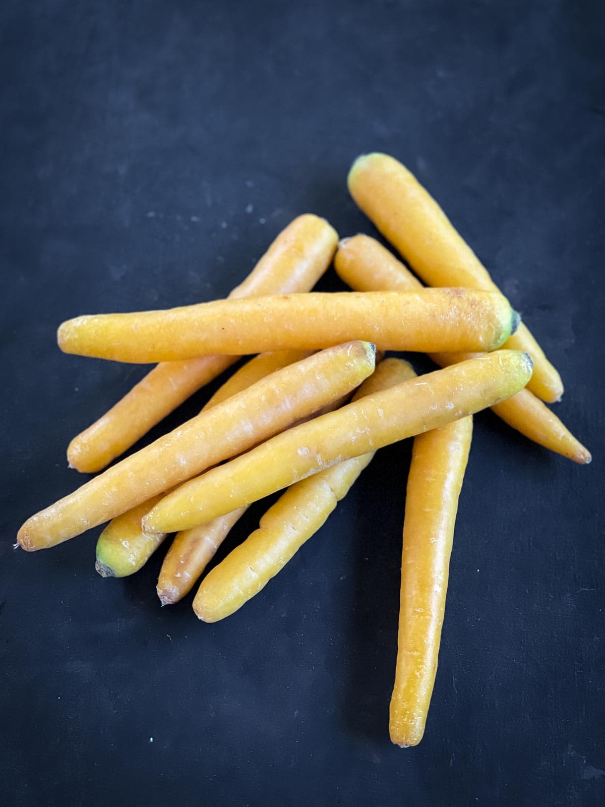 Bunch of raw yellow carrots