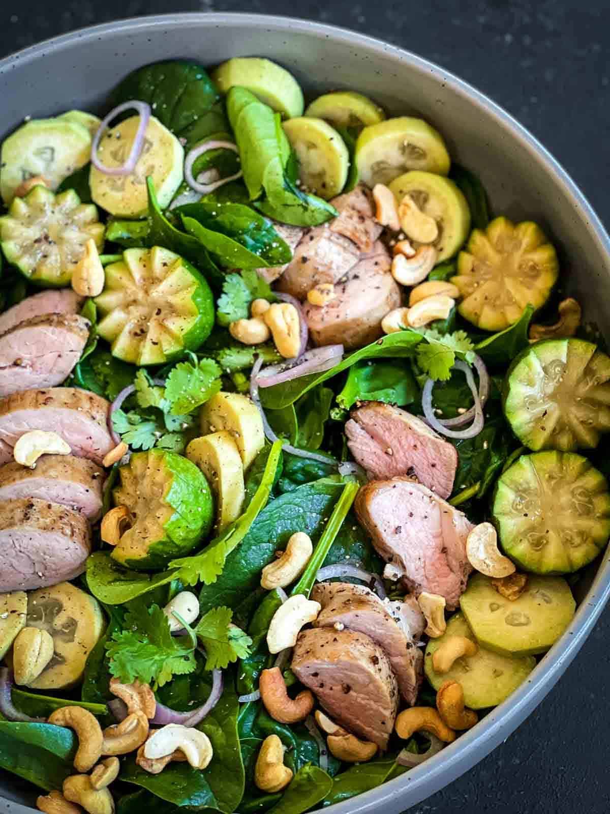 Sous Vide Pork Tenderloin Salad in a round salad bowl