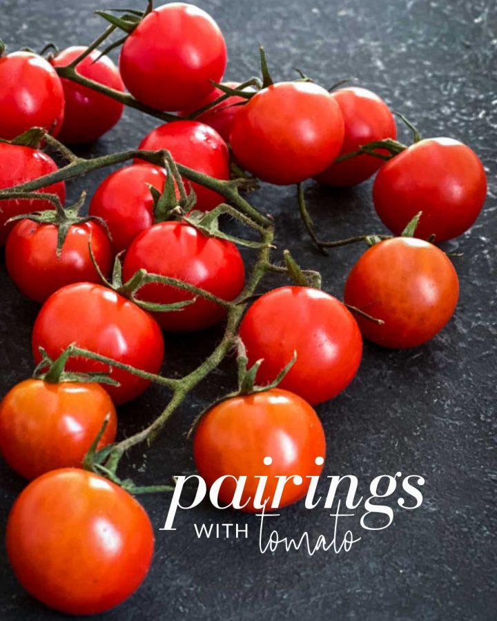 Image of a bunch of truss tomatoes with the text overlay "pairings with tomatoes"