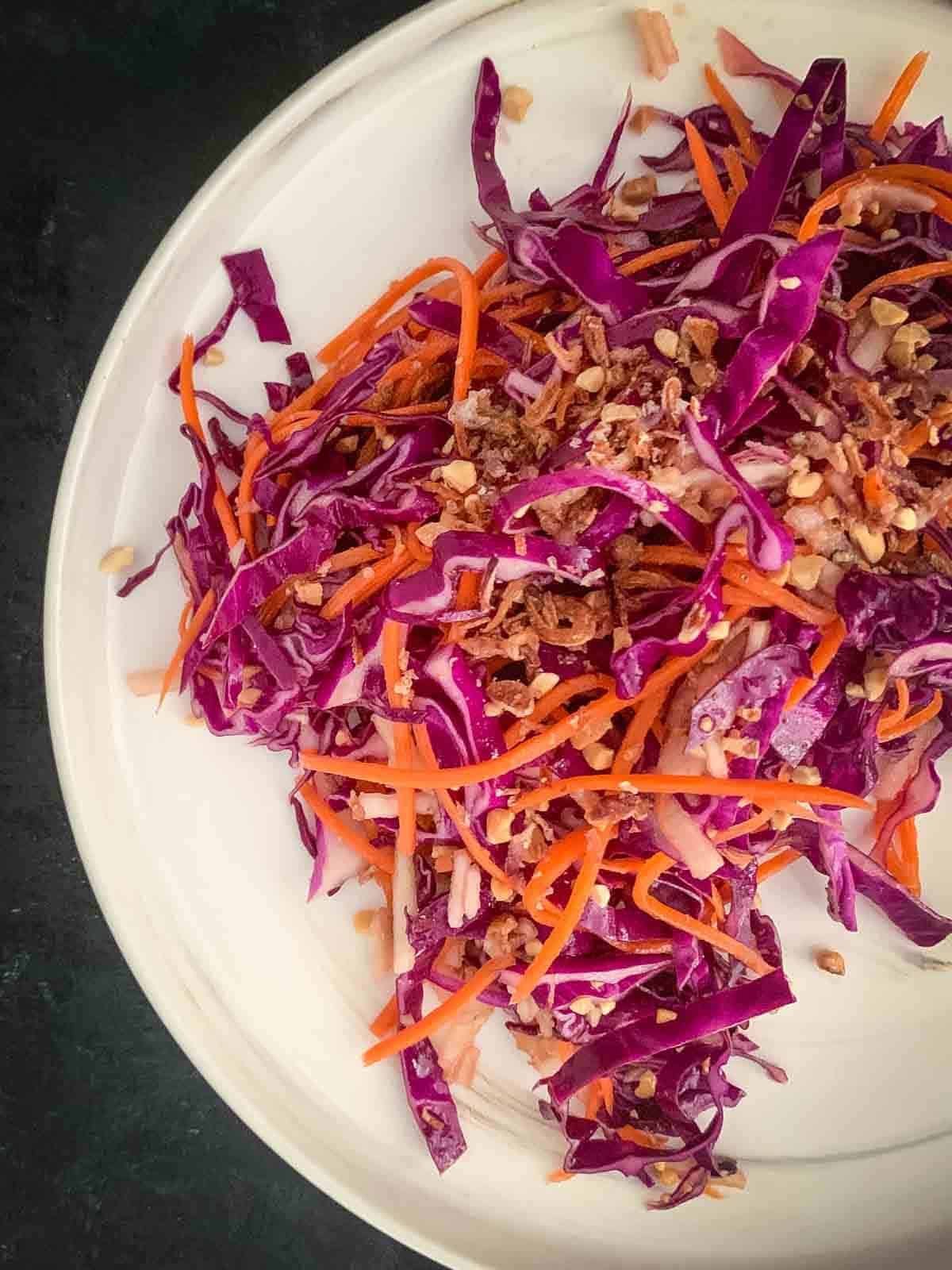 Vegan Coleslaw with Pear and Carrot on a white plate