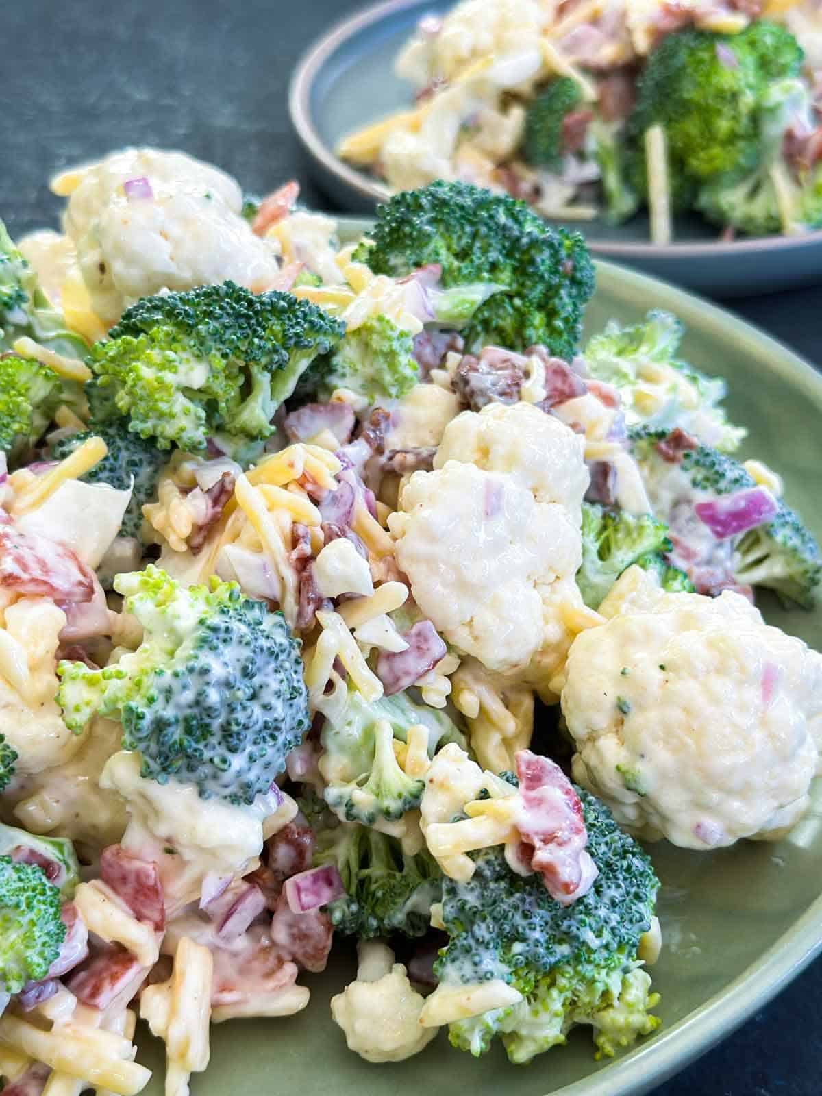 2 Amish broccoli salads on green plates