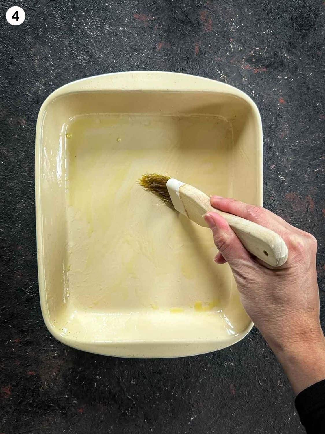 Basting baking dish with olive oil