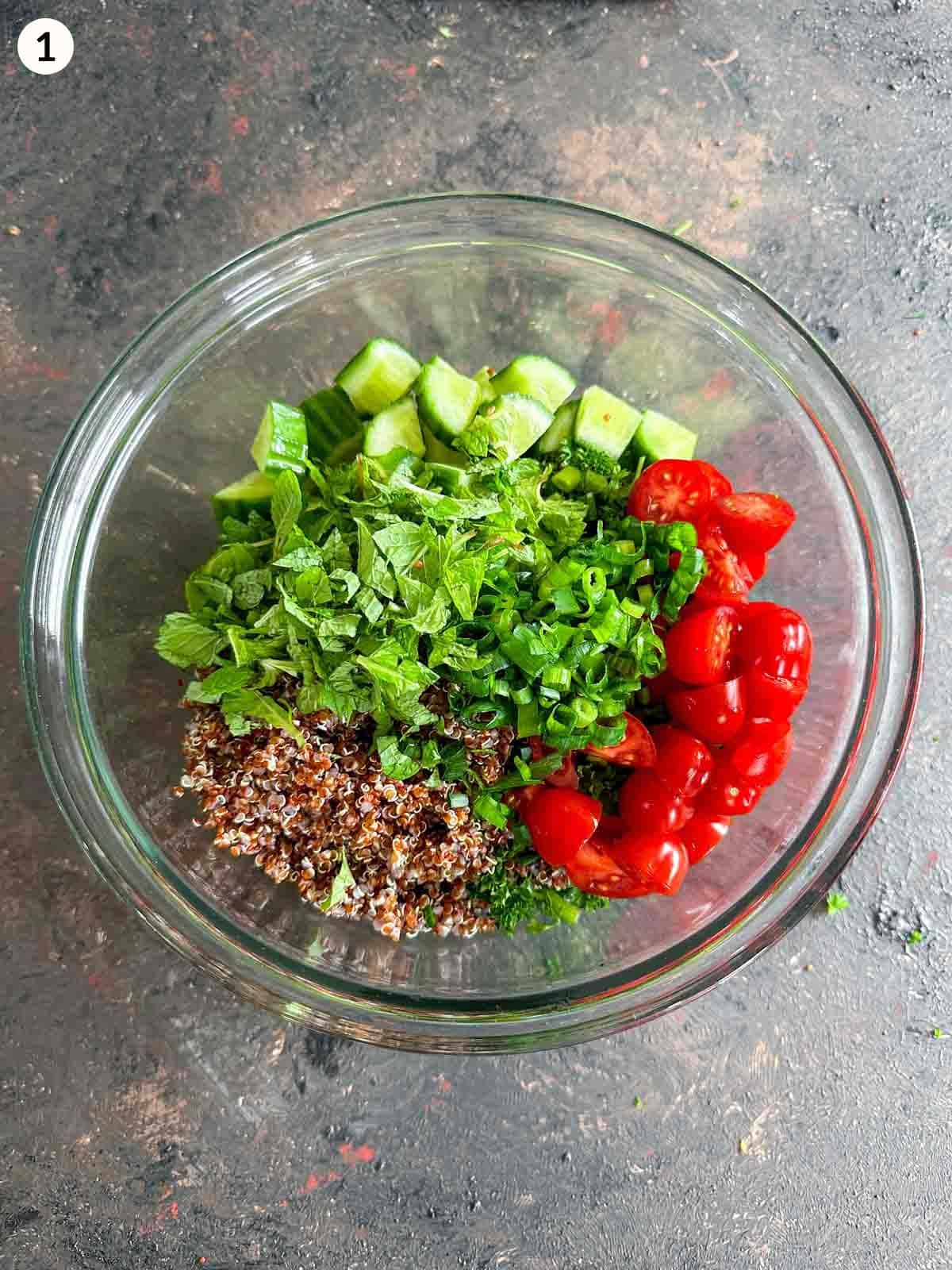 Ingredients for vegan quinoa salad in a mixing bowl