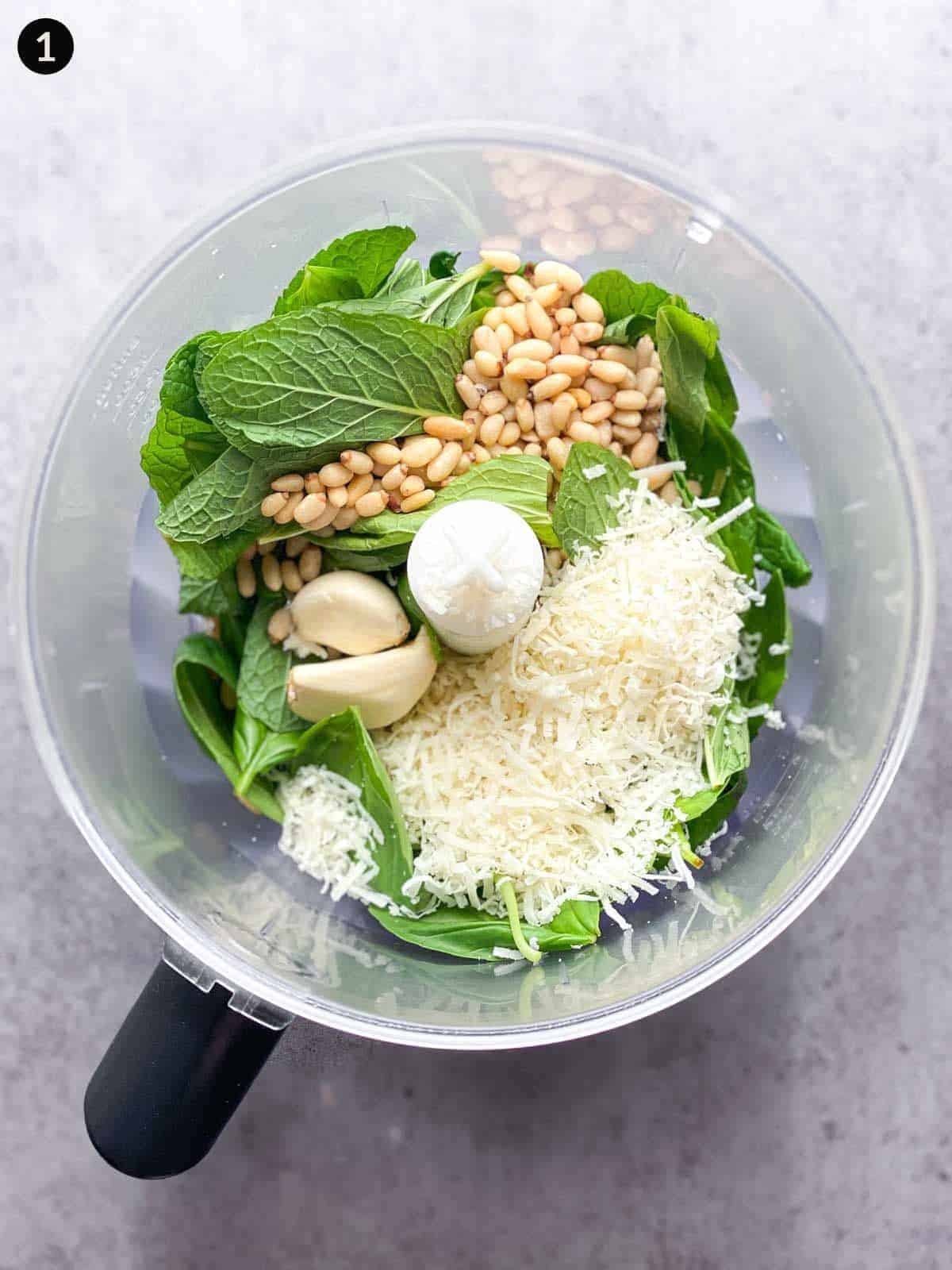 Ingredients for basil mint pesto in a food processor