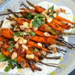 Harissa Carrots with Tzatziki on a grey plate