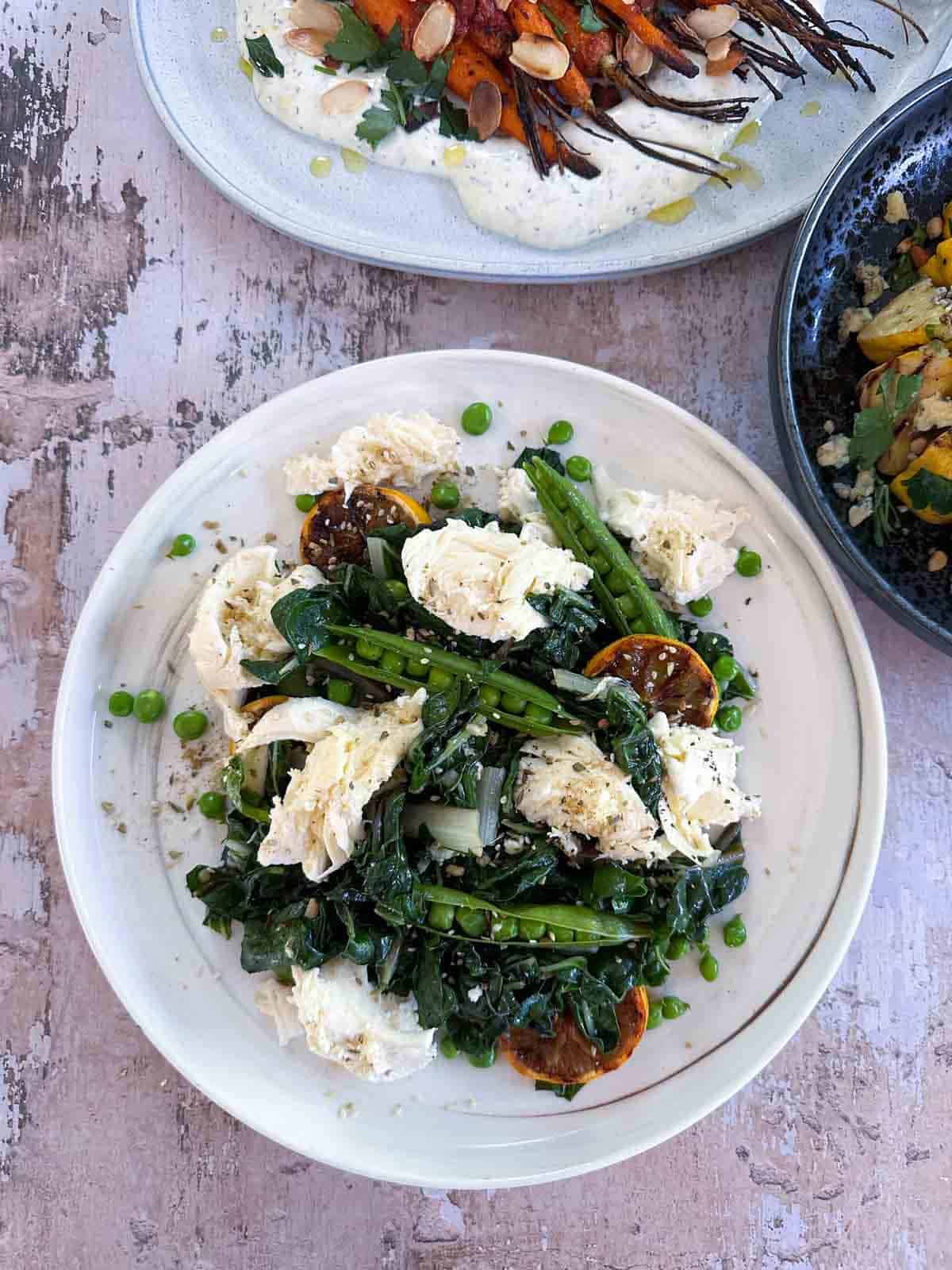 Sautéed Silverbeet with Peas on a white plate